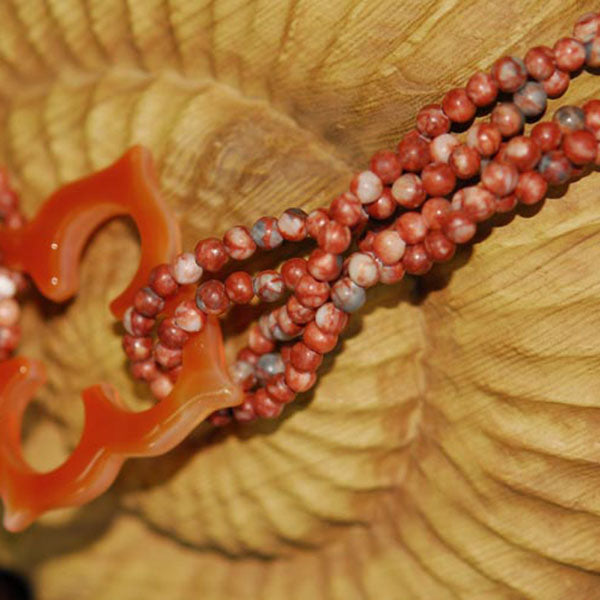 Multi Strand Twisted Sesame Jasper Necklace with Floral Cutout Orange Agate Focal Pendant